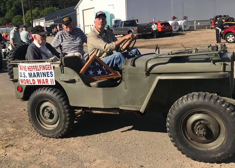 Loudonville Memorial Day Parade photograph of man driving a vehicle in the parade.